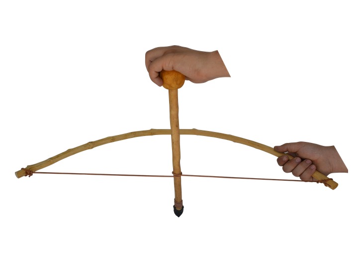 Hands operating a reconstructed ancient Greek bow drill