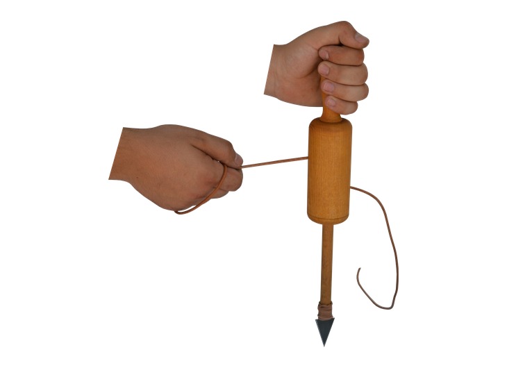 Hands operating a reconstructed drill with a wound strap