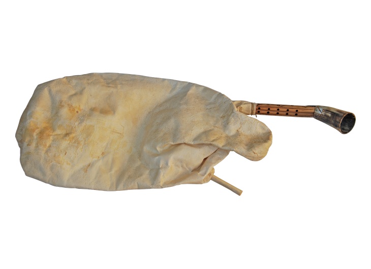 Reconstructed askaulos bagpipe with an animal-skin bag and reed pipes